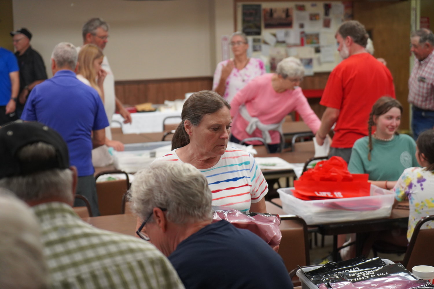 Volunteers gather in Knights of Columbus Council 831’s hall in Sedalia on Aug. 3, to fill 3,000 bags with informational materials for the 48th annual Right to Life booth at the Missouri State Fair in Sedalia.